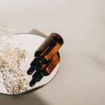 Minimalist still life with amber bottles on a mirror showcasing skincare elegance