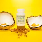 CBD capsules with coconut shells on a vibrant yellow background