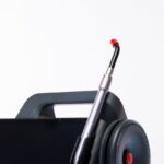 Close-up of a dental laser machine with a screen and handpiece, showcasing modern medical technology